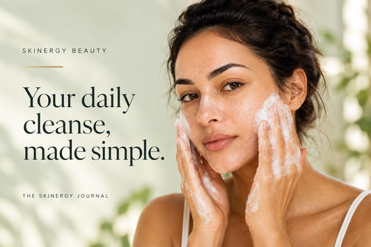 Woman gently washing her face beside the words Your daily cleanse, made simple, on a soft green Skinergy Journal cover.